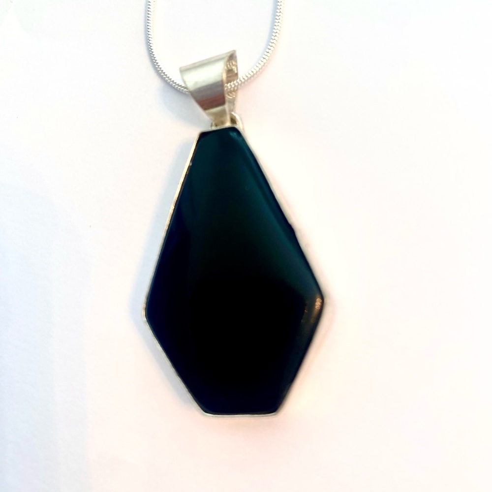 Beautiful, 1 1/2 inch, 925 marked, Black Sunstone pendant on a silver chain.